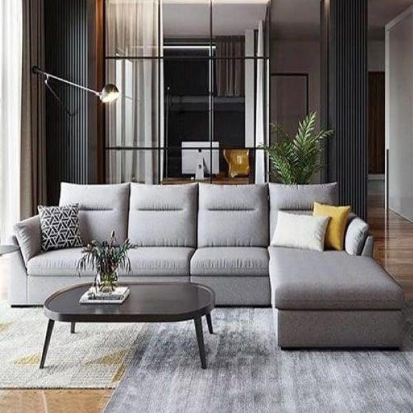 Sofa màu xám bọc vải phối với gối màu và họa tiết
